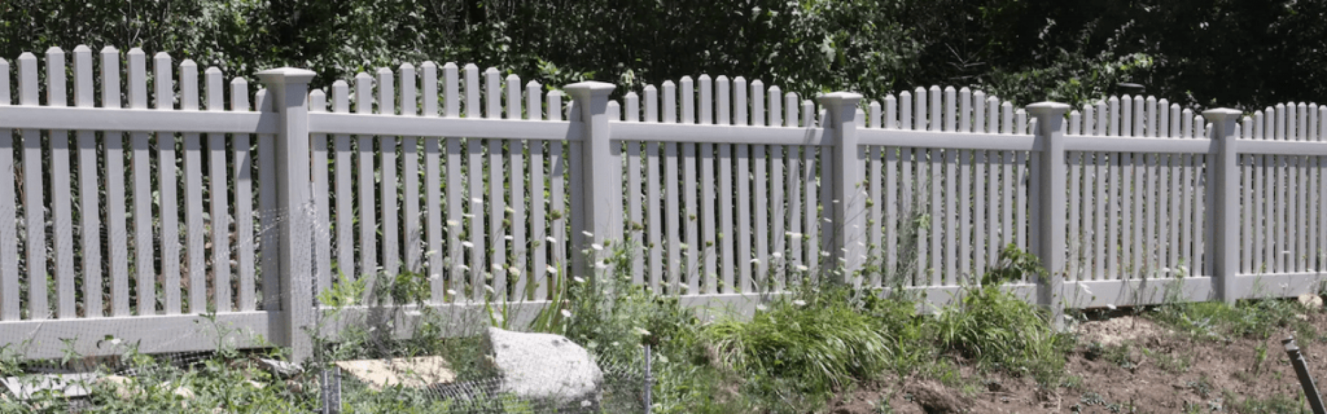 Spaced Vinyl Fence With Trees in the Backyard